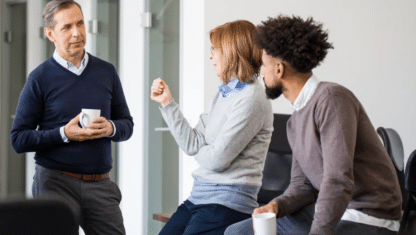 A global team of consultants sitting in an office discussing innovation.
